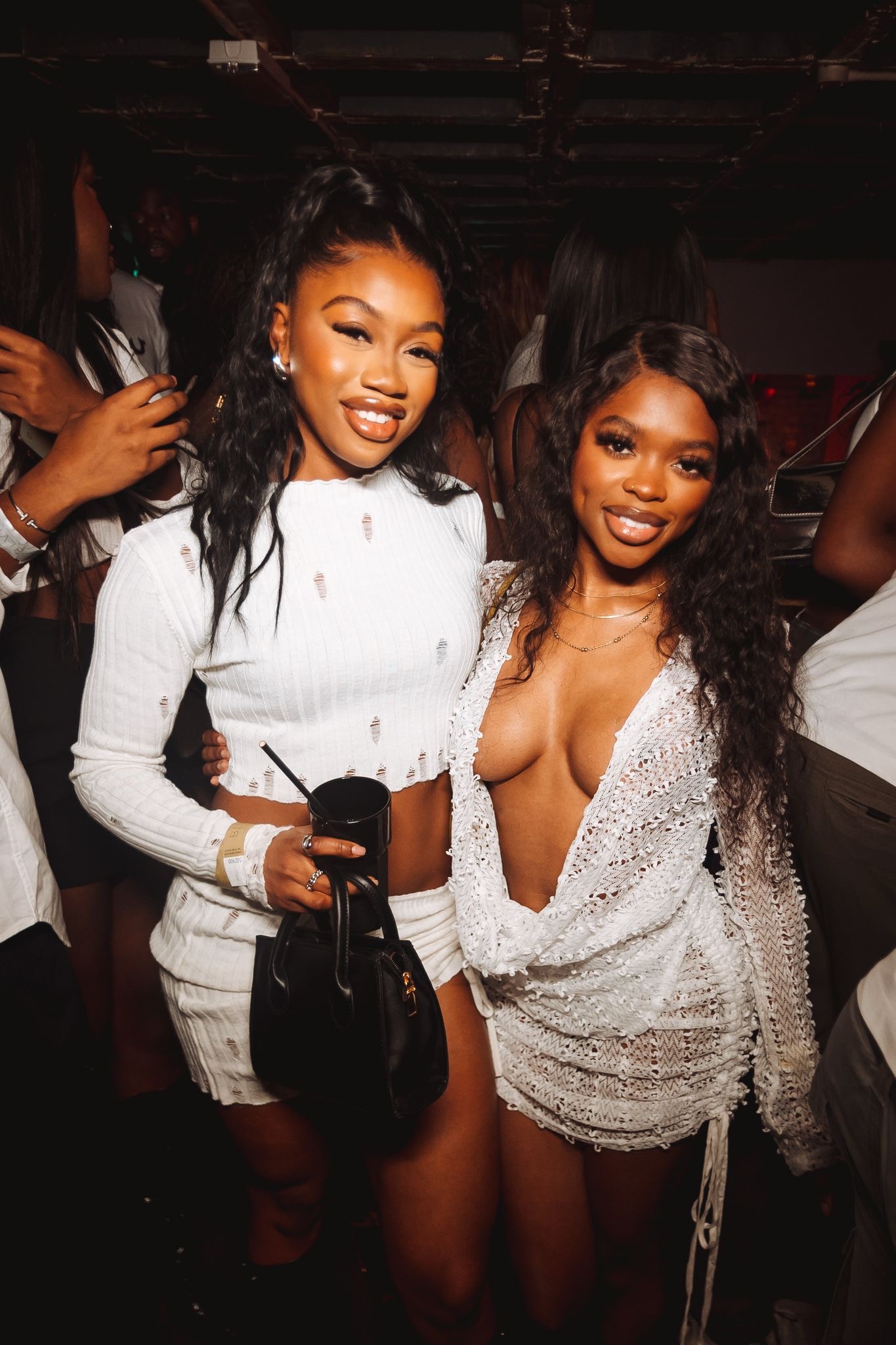 Two guests dressed in white at Timeless